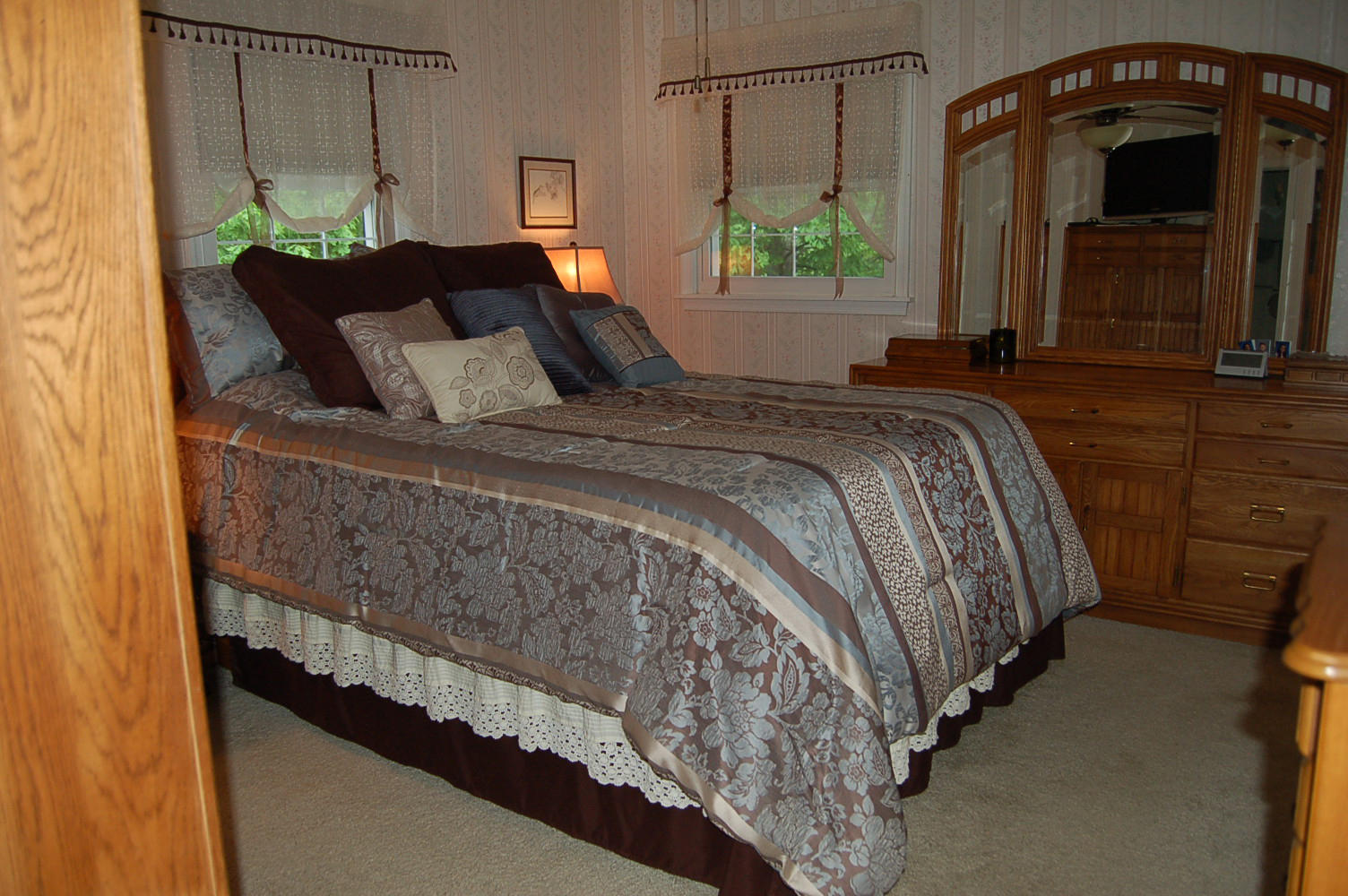 384 Pin Oak Drive Blue Ridge, VA 24064 - Photo 25 of 57 a bed sitting in a bedroom next to a window with pc on the wall