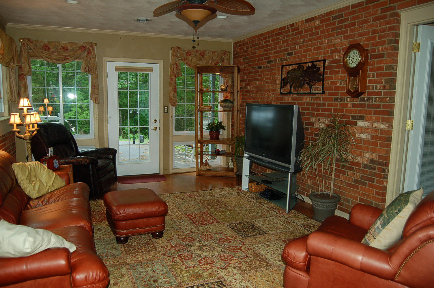 384 Pin Oak Drive Blue Ridge, VA 24064 - Photo 30 of 57 a living room with furniture a flat screen tv and floor to ceiling window