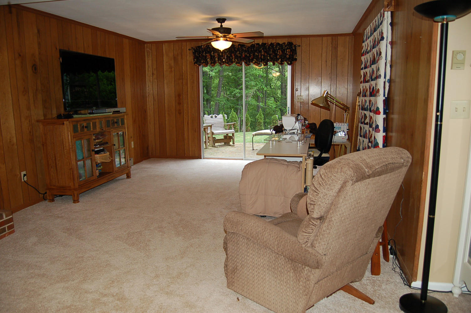 384 Pin Oak Drive Blue Ridge, VA 24064 - Photo 36 of 57 a living room with furniture a flat screen tv and a large window