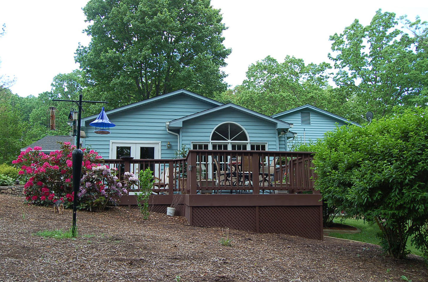 384 Pin Oak Drive Blue Ridge, VA 24064 - Photo 38 of 57 a front view of house with yard and trees in the background