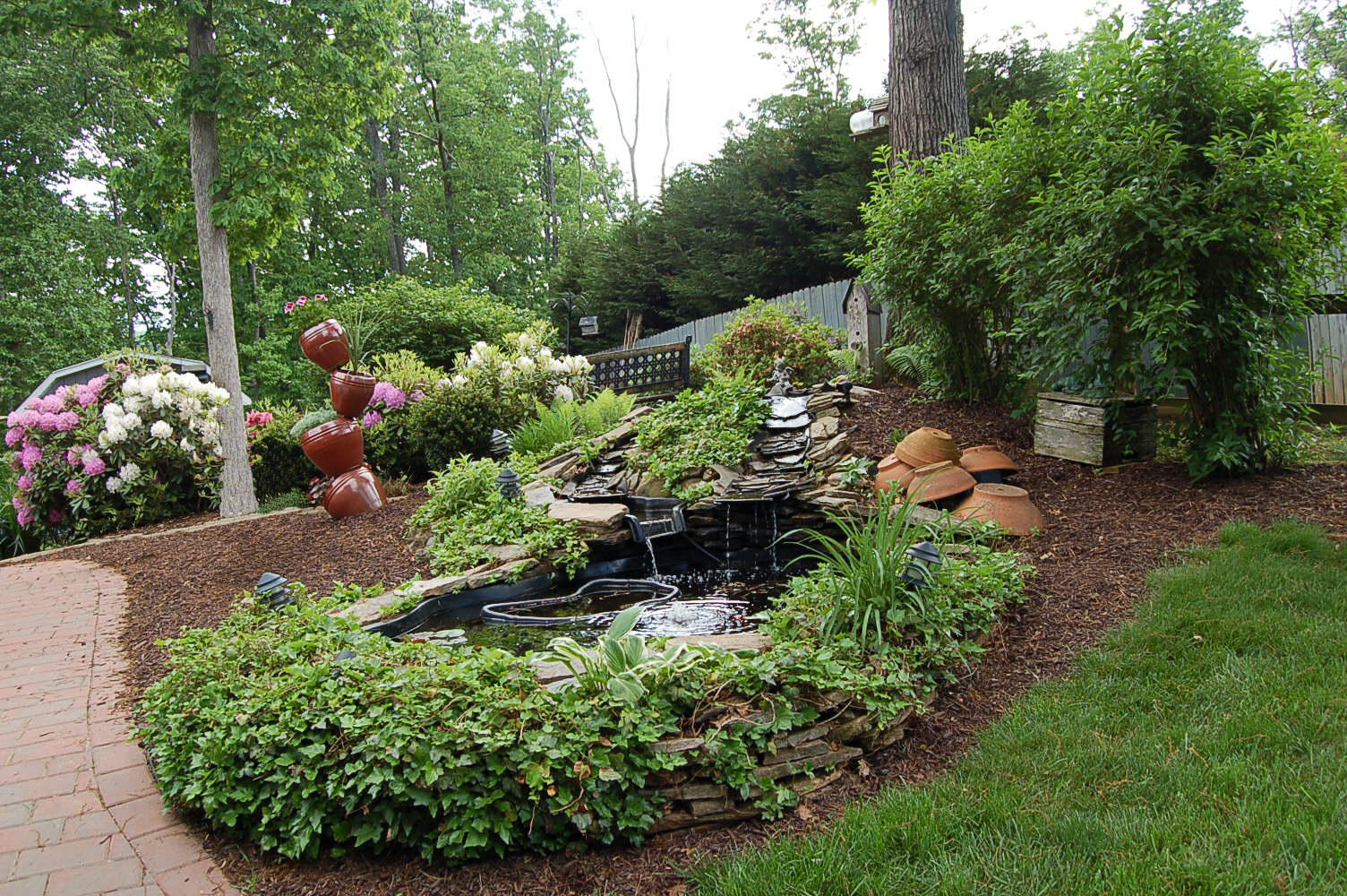 384 Pin Oak Drive Blue Ridge, VA 24064 - Photo 46 of 57 a view of a garden with flowers and trees