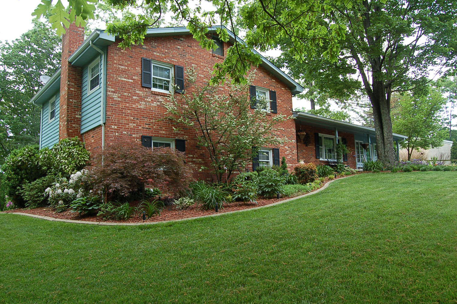 384 Pin Oak Drive Blue Ridge, VA 24064 - Photo 50 of 57 a front view of a house with a yard and porch