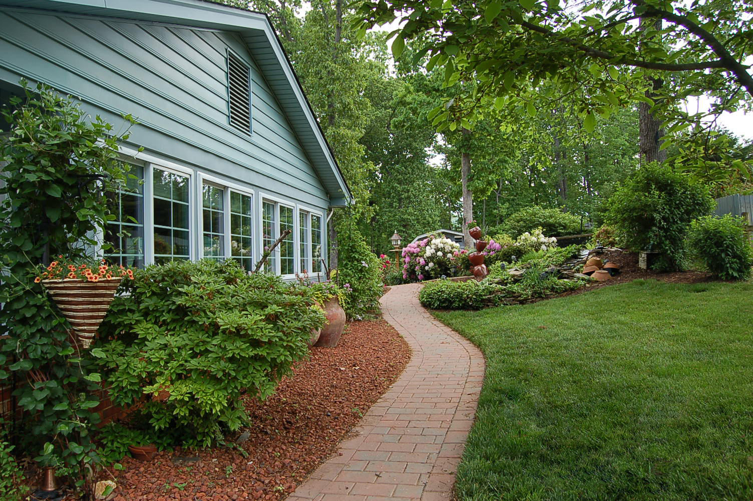 384 Pin Oak Drive Blue Ridge, VA 24064 - Photo 51 of 57 a view of a house with a yard and garden