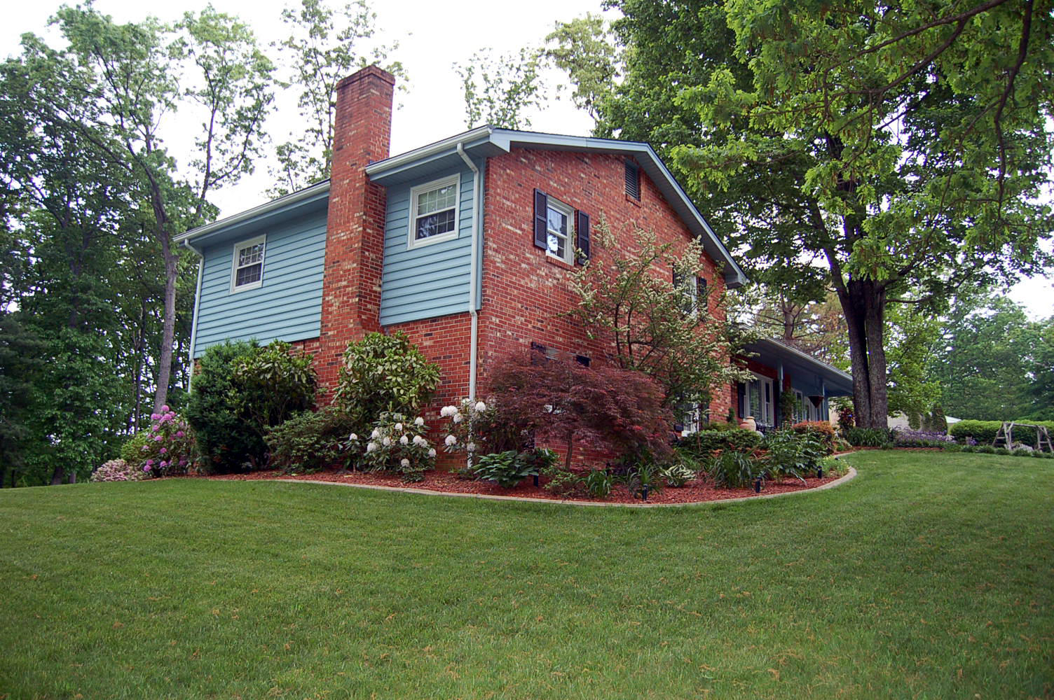 384 Pin Oak Drive Blue Ridge, VA 24064 - Photo 52 of 57 a front view of a house with a garden