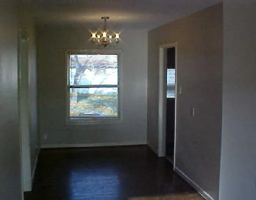 a view of a windows and chandelier in a room