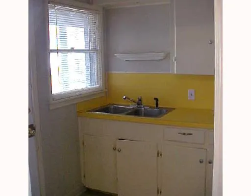 a bathroom with a sink and a window