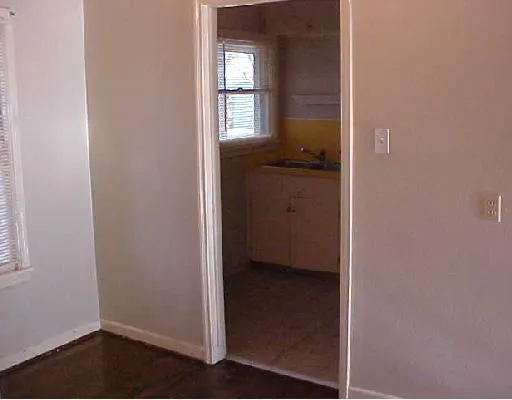a view of a bathroom from a hallway