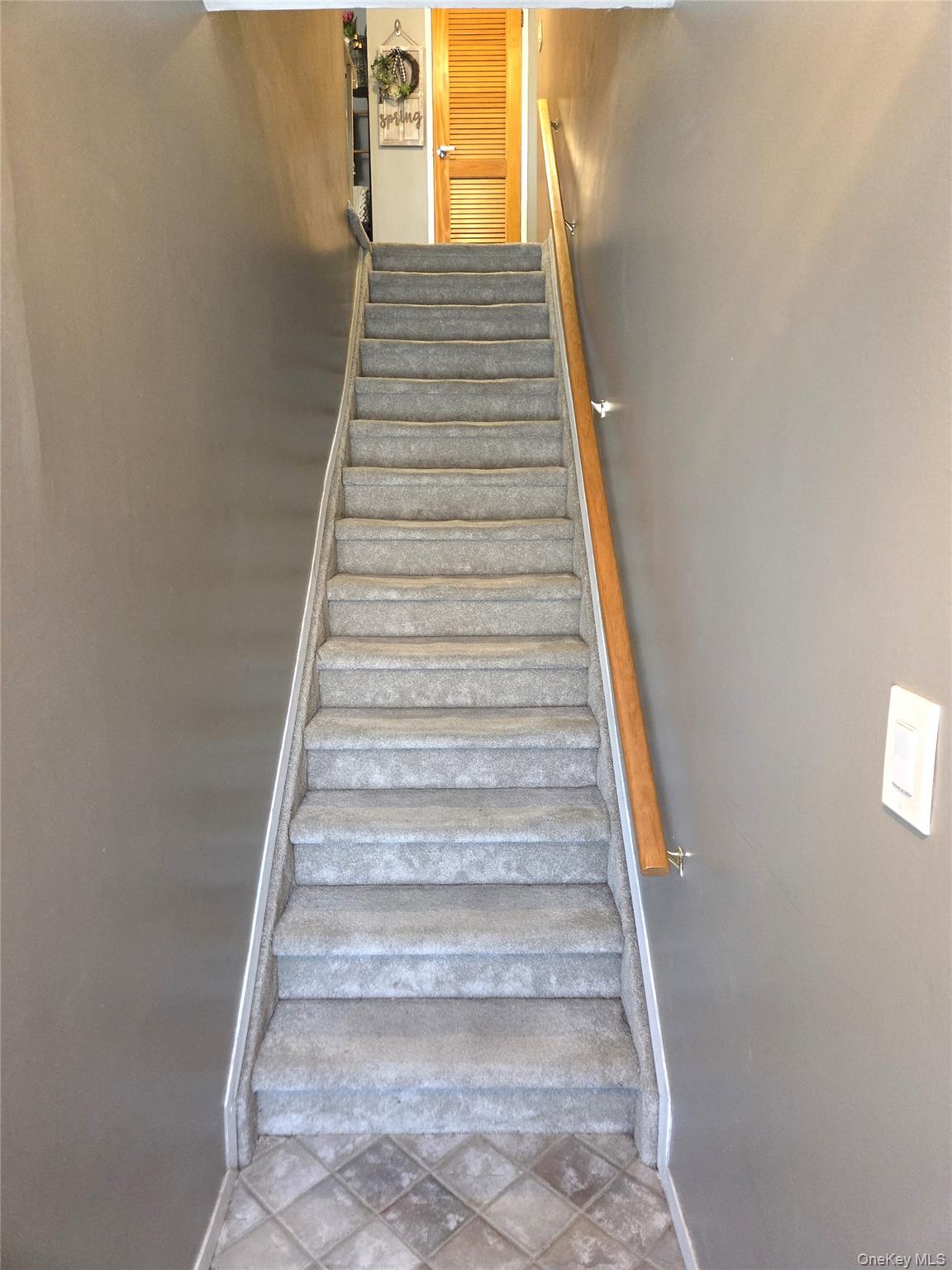 655 Middle Country Road, Unit 6A2 Coram, NY 11727 - Photo 5 of 19 The Entrance Foyer Offers A Diagonal Ceramic Tiled Floor & Lovely Stairway To The Second Level With A Good Sized Coat Closet.