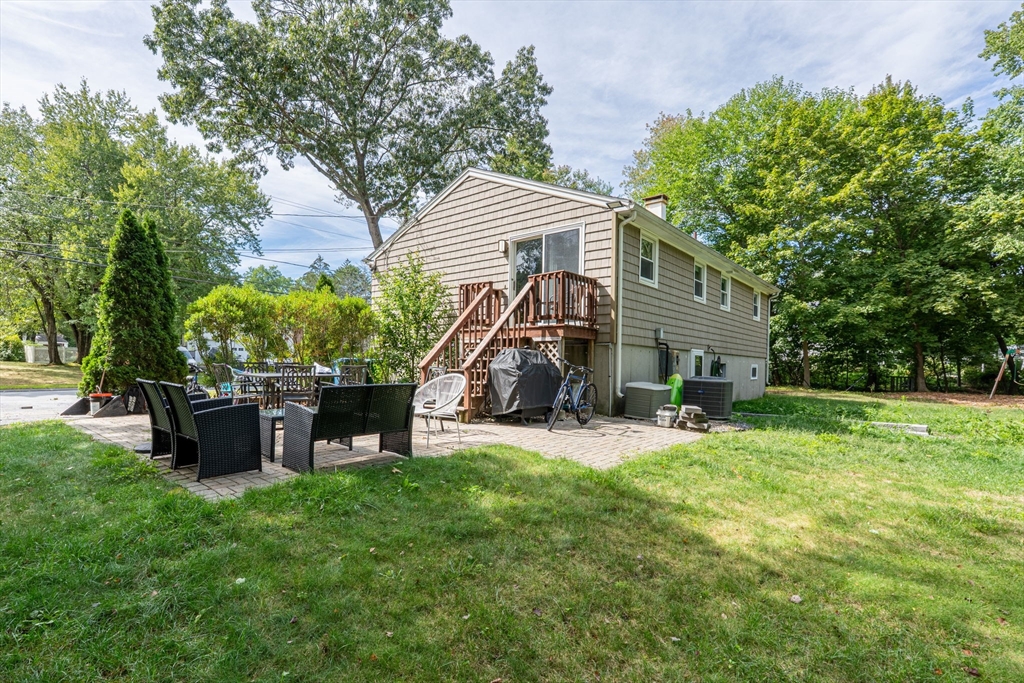 8 Governor Fuller Road Billerica, MA 01821 - Photo 5 of 33 a view of a house with a yard and sitting area