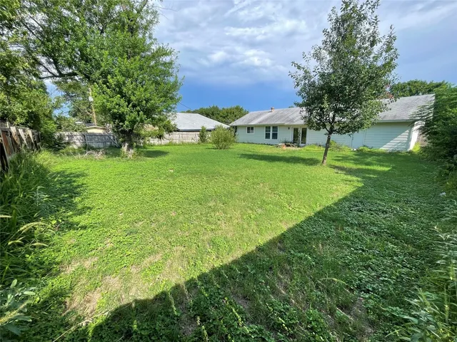 a view of house with garden