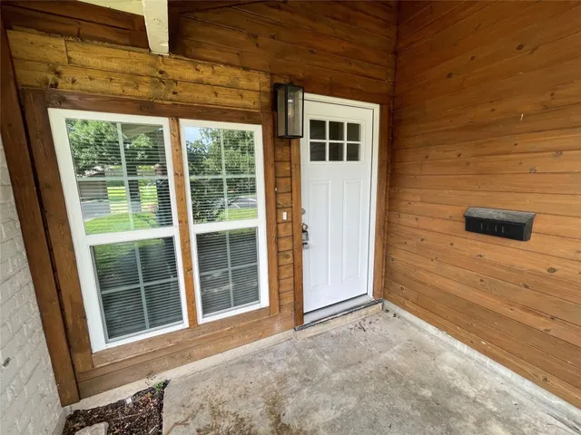 a view of a house with a large window