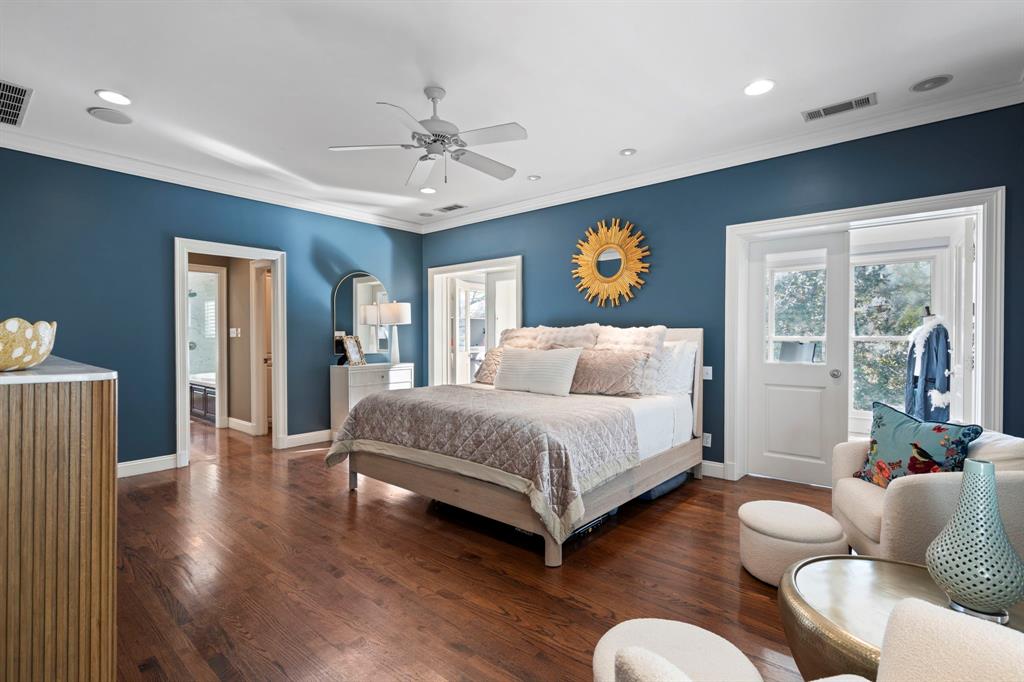 6936 Pasadena Avenue Dallas, TX 75214 - Photo 17 of 39 a spacious bedroom with a bed and wooden floor