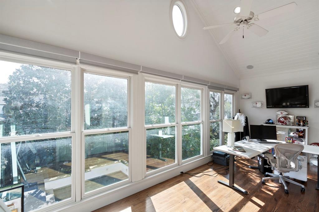 6936 Pasadena Avenue Dallas, TX 75214 - Photo 18 of 39 a living room with a large window and a table