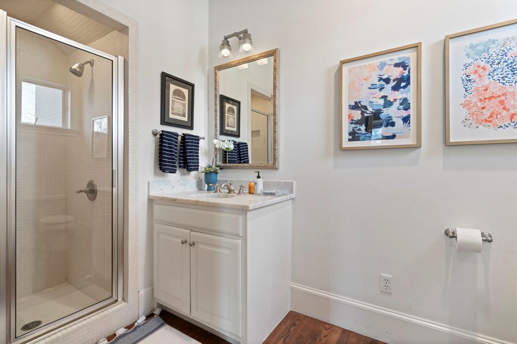 6936 Pasadena Avenue Dallas, TX 75214 - Photo 28 of 39 a bathroom with a sink mirror and vanity