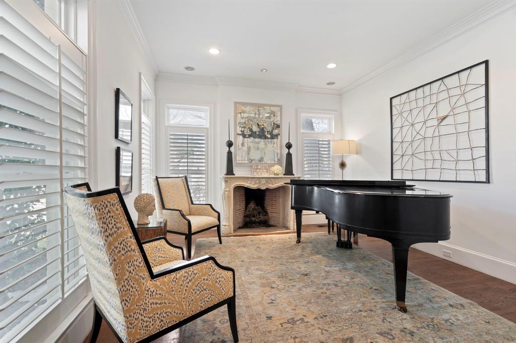 6936 Pasadena Avenue Dallas, TX 75214 - Photo 3 of 39 a living room with furniture a fireplace and a table