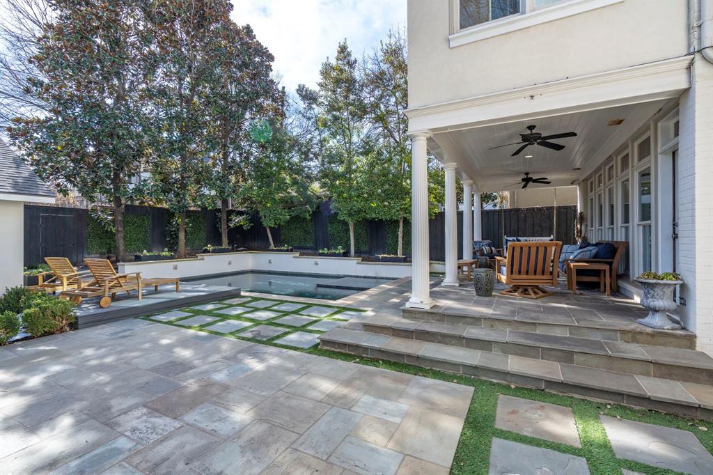 6936 Pasadena Avenue Dallas, TX 75214 - Photo 38 of 39 a view of a patio with couches and table and chairs with wooden fence and plants