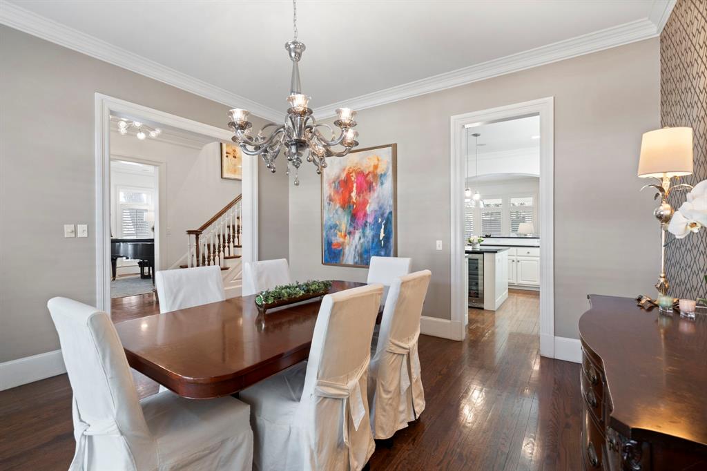 6936 Pasadena Avenue Dallas, TX 75214 - Photo 6 of 39 a view of a dining room with furniture wooden floor and chandelier