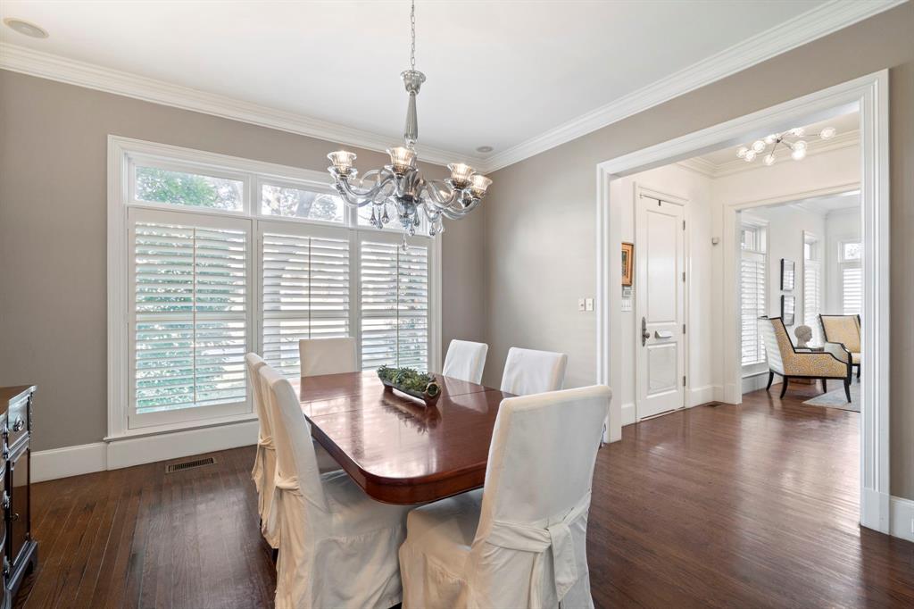 6936 Pasadena Avenue Dallas, TX 75214 - Photo 7 of 39 a view of a dining room with furniture wooden floor and chandelier