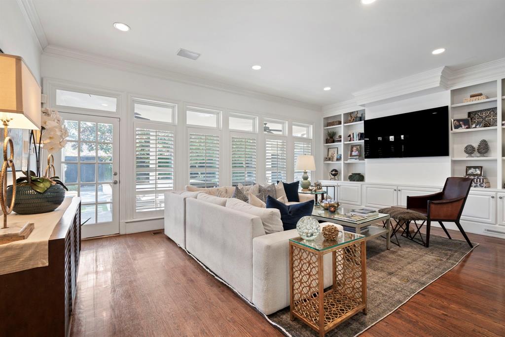 6936 Pasadena Avenue Dallas, TX 75214 - Photo 10 of 39 a living room with furniture a flat screen tv and a large window