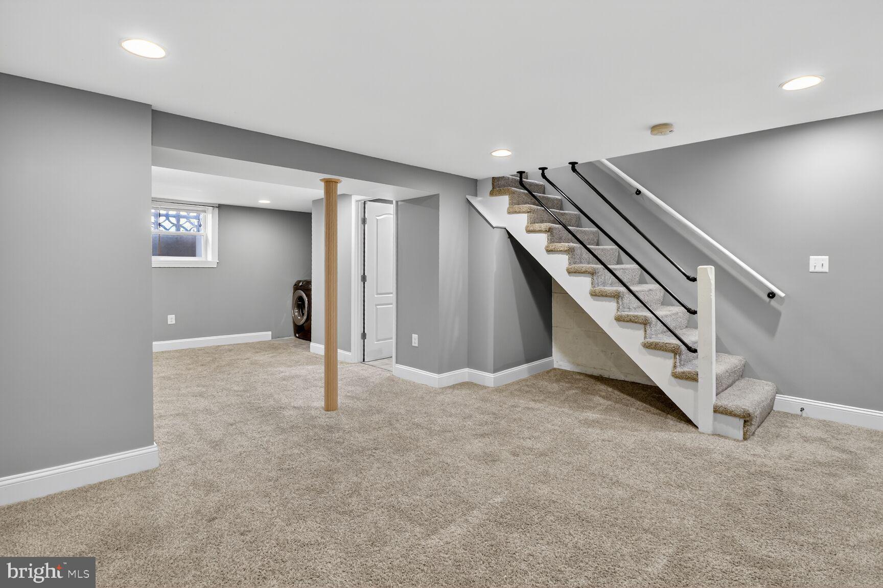 1922 Ormand Road Baltimore, MD 21222 - Photo 25 of 32 an empty room with staircase and white walls