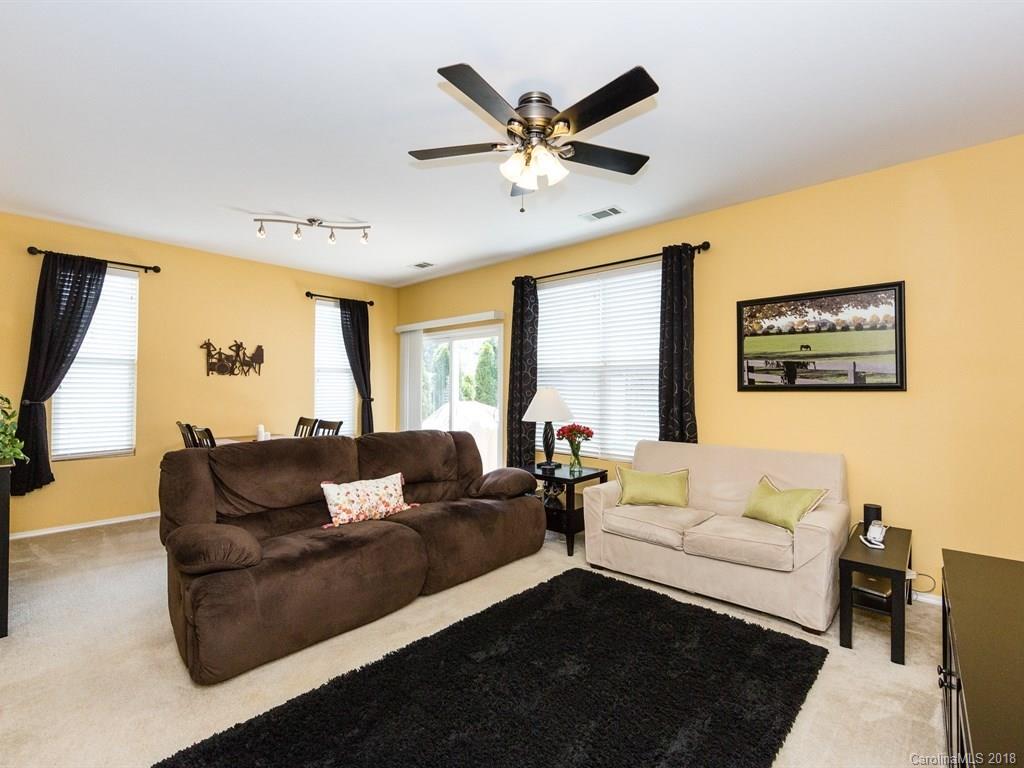 257 River Clay Road Fort Mill, SC 29708 - Photo 5 of 11 a living room with furniture and a large window