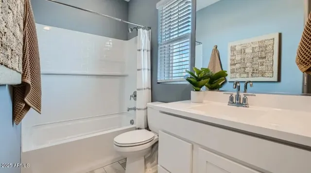 a bed room with a bed and a potted plant