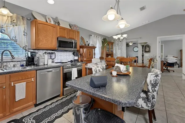 a kitchen with granite countertop lots of counter top space