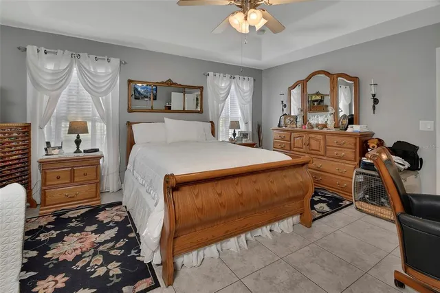 a bed room with a bed and a television