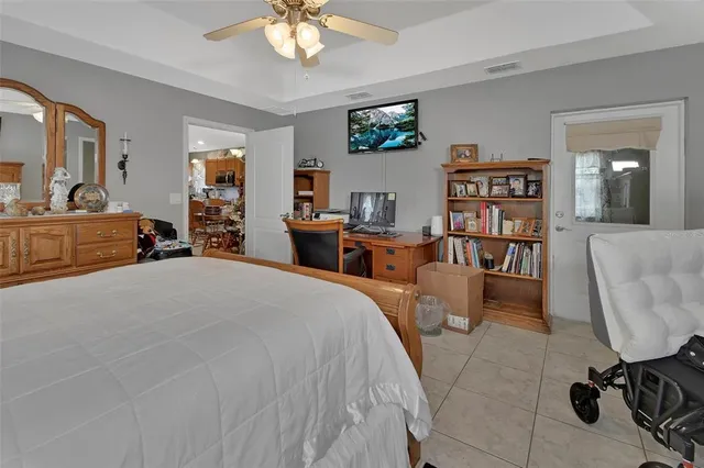 a bed room with a bed and a chair