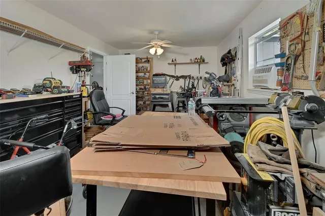 a utility room with multiple dryer and washer