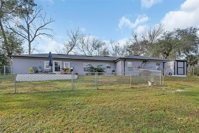 a view of house with a swimming pool