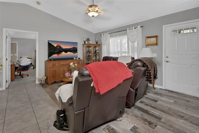 a bedroom with furniture and a chandelier