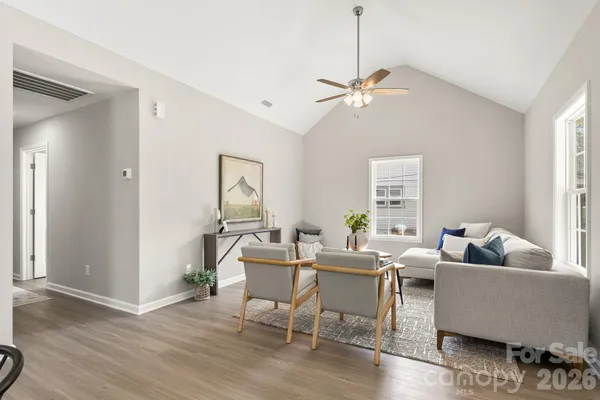 a living room with furniture and a window