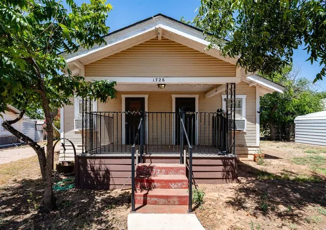 a front view of house with street