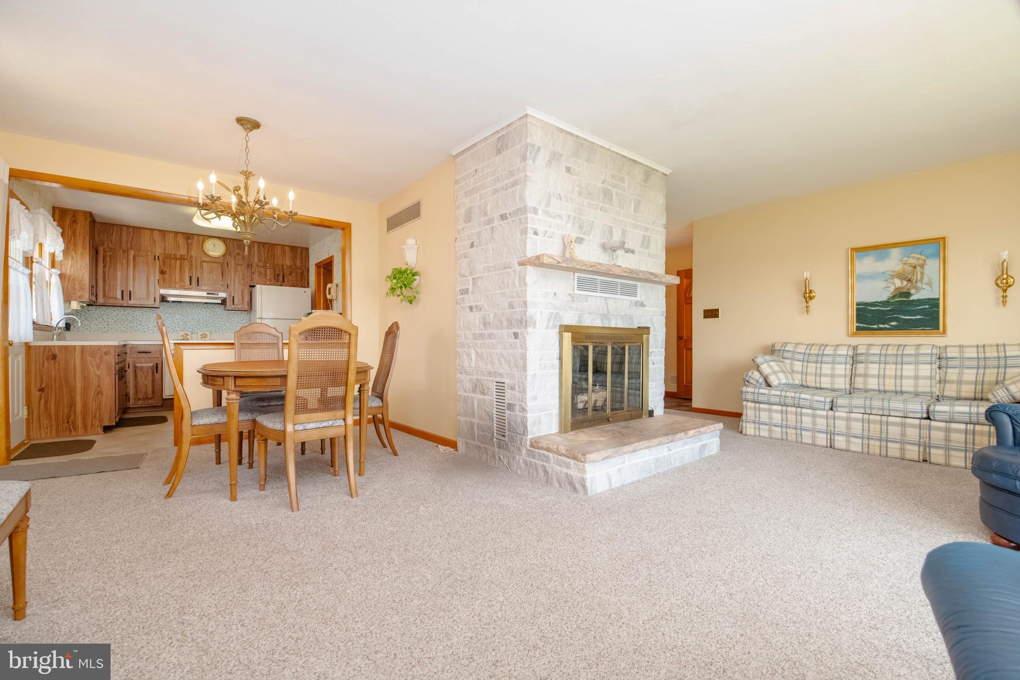 6610 River Drive Road Baltimore, MD 21219 - Photo 5 of 30 a view of a livingroom with furniture and a fireplace