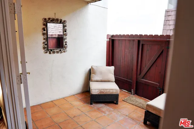 a view of a pathway with a wooden fence