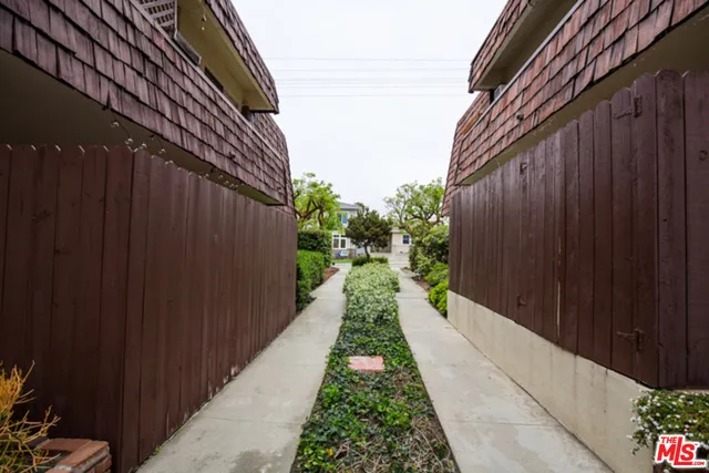 a view of an empty room with a window and balcony
