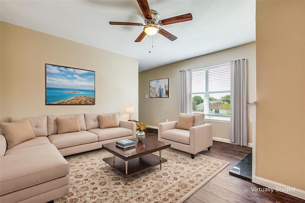 2200 East Trinity Mills Road, Unit 402 Carrollton, TX 75006 - Photo 6 of 12 a living room with furniture and a large window