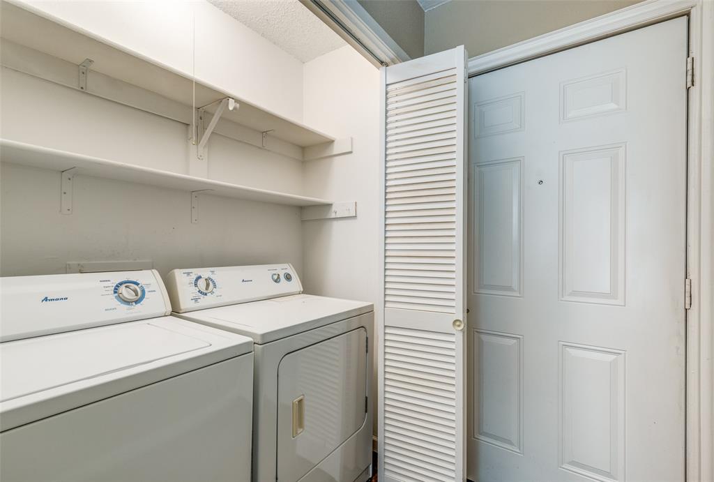 2200 East Trinity Mills Road, Unit 402 Carrollton, TX 75006 - Photo 8 of 12 a utility room with dryer and washer