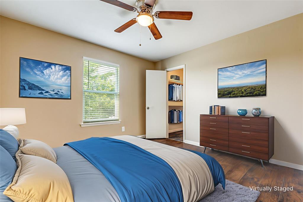 2200 East Trinity Mills Road, Unit 402 Carrollton, TX 75006 - Photo 10 of 12 a bed room with a bed and a window