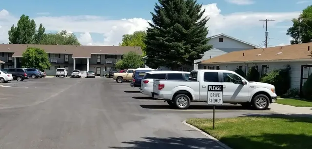a view of a car parked in front of a house
