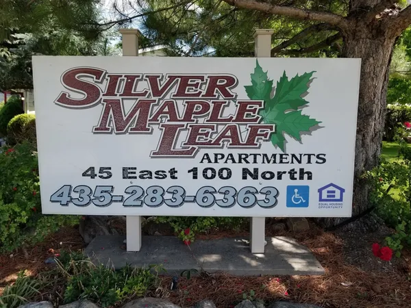 a sign broad on a brick wall