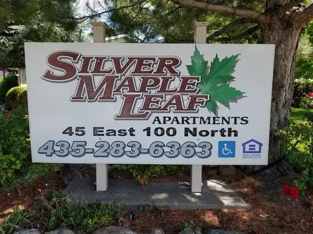 a sign broad on a brick wall