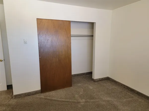 an empty room with closet