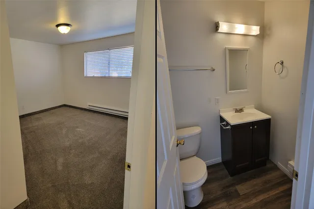 a bathroom with a toilet sink and mirror