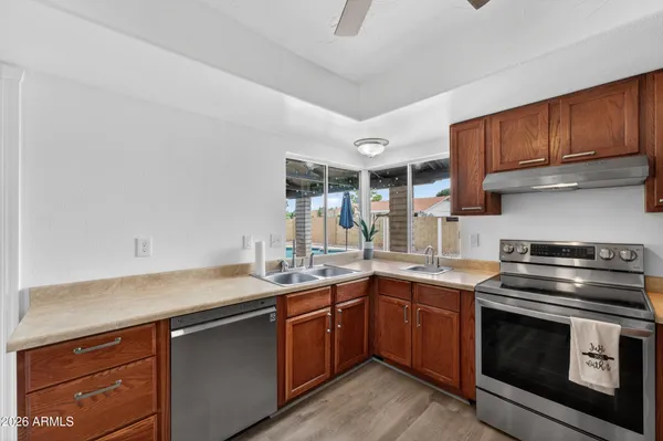 a kitchen with a sink and stove