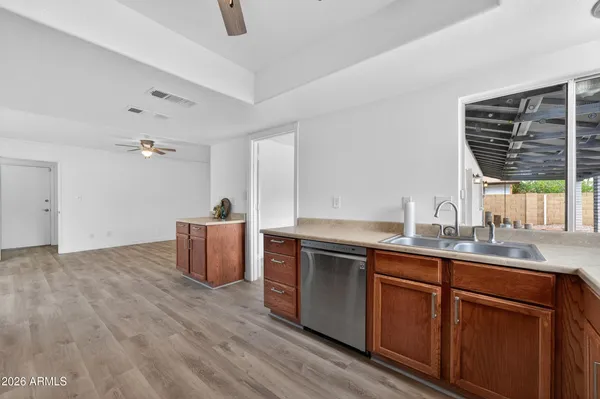 a kitchen with sink and window