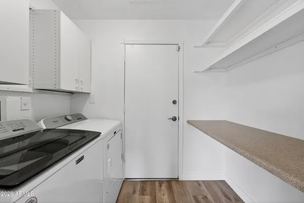 a kitchen with a sink and cabinets