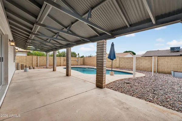 a view of a backyard of the house