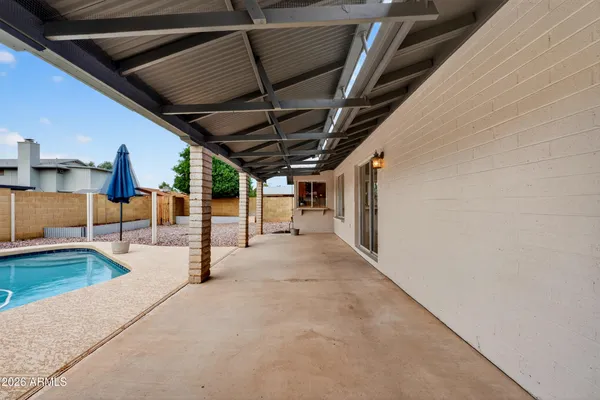 a view of a swimming pool with a chair